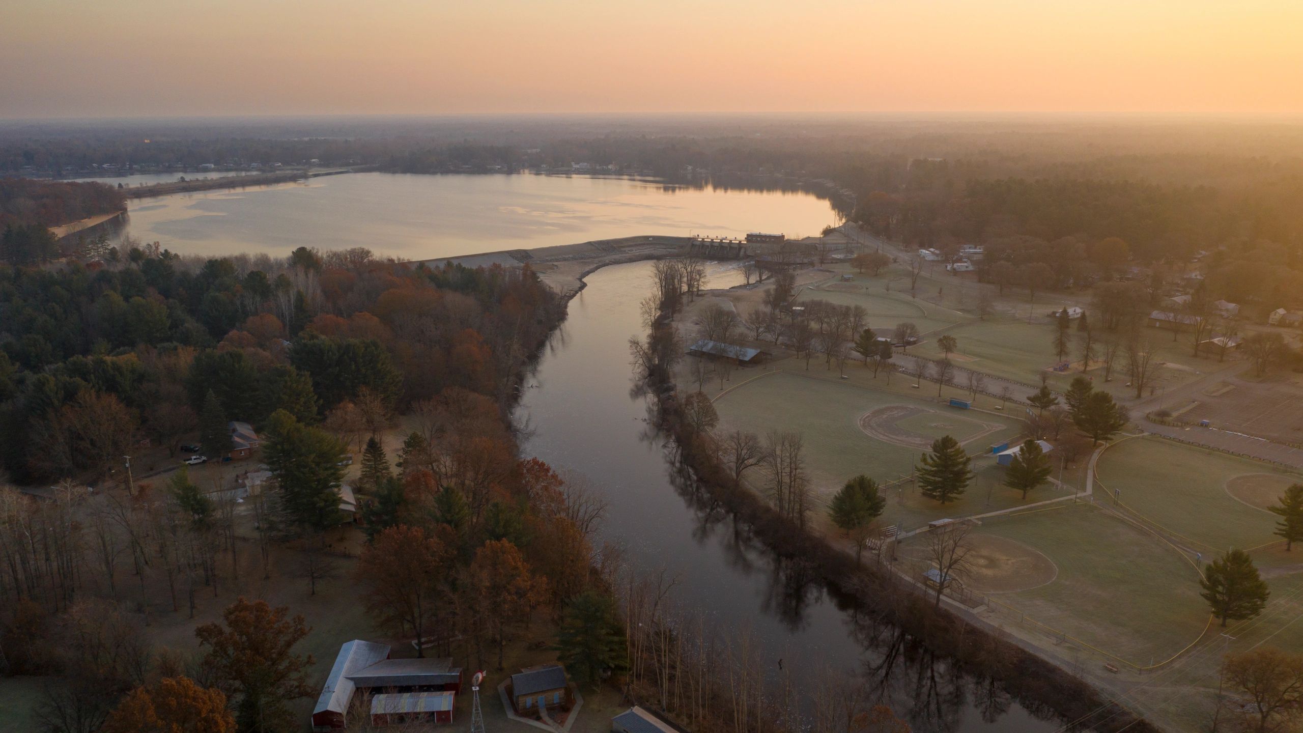 Aerial View of Sunrise over Michigan Lake and River