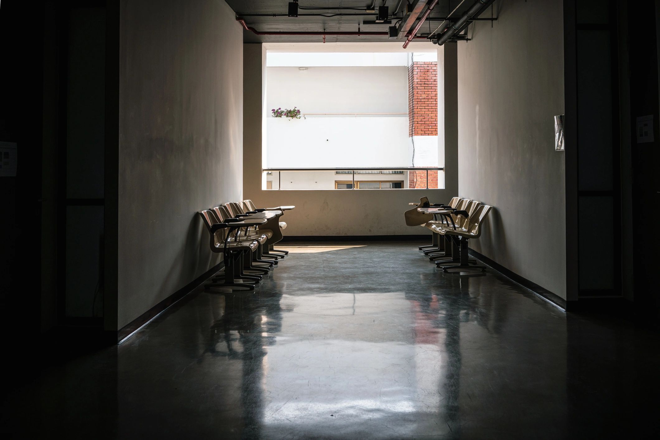 Concrete corridor with architectural light and shadow