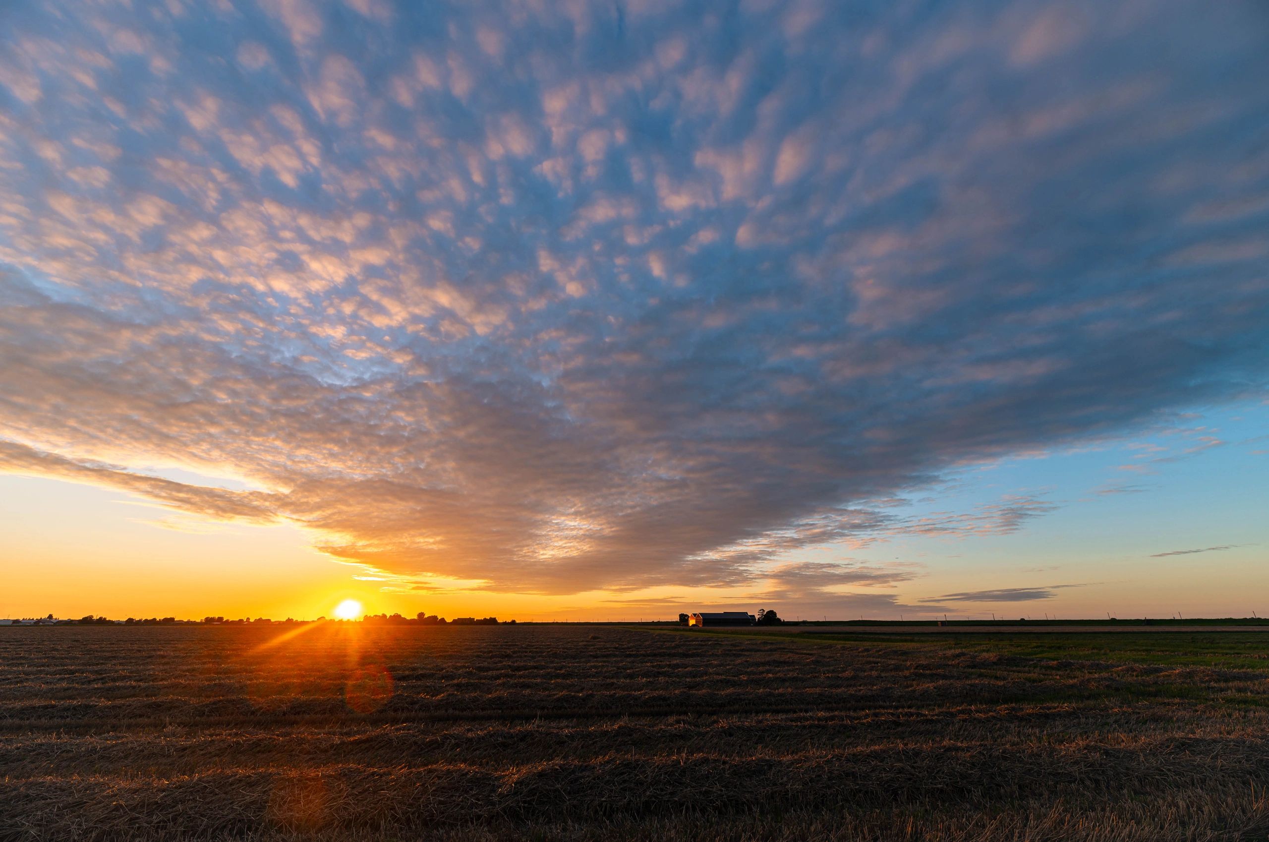 Kansas plains ranch landscape at sundown