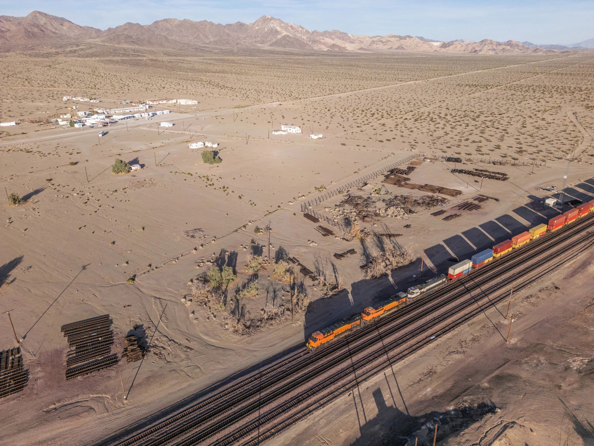 Freight train moving through a Nevada desert landscape