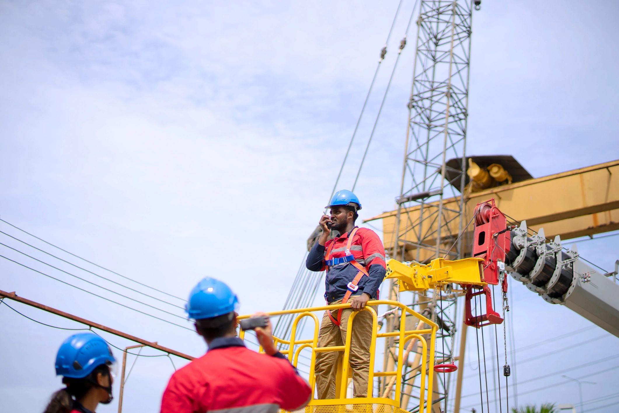Engineers reviewing plans at a construction site for a bunker planning project