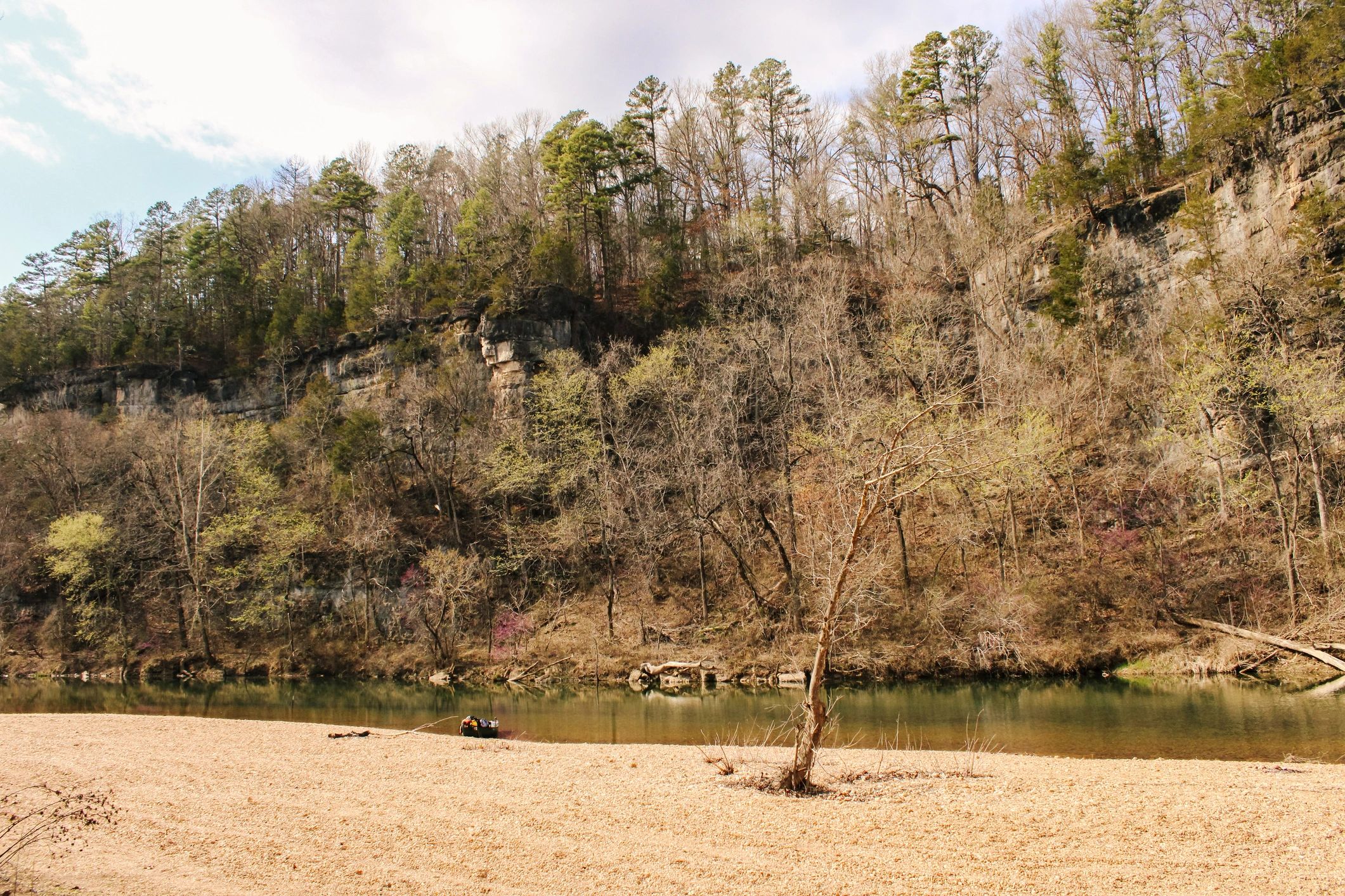 Bluffs along the riverside Ozark National Scenic Riverways camp beach
