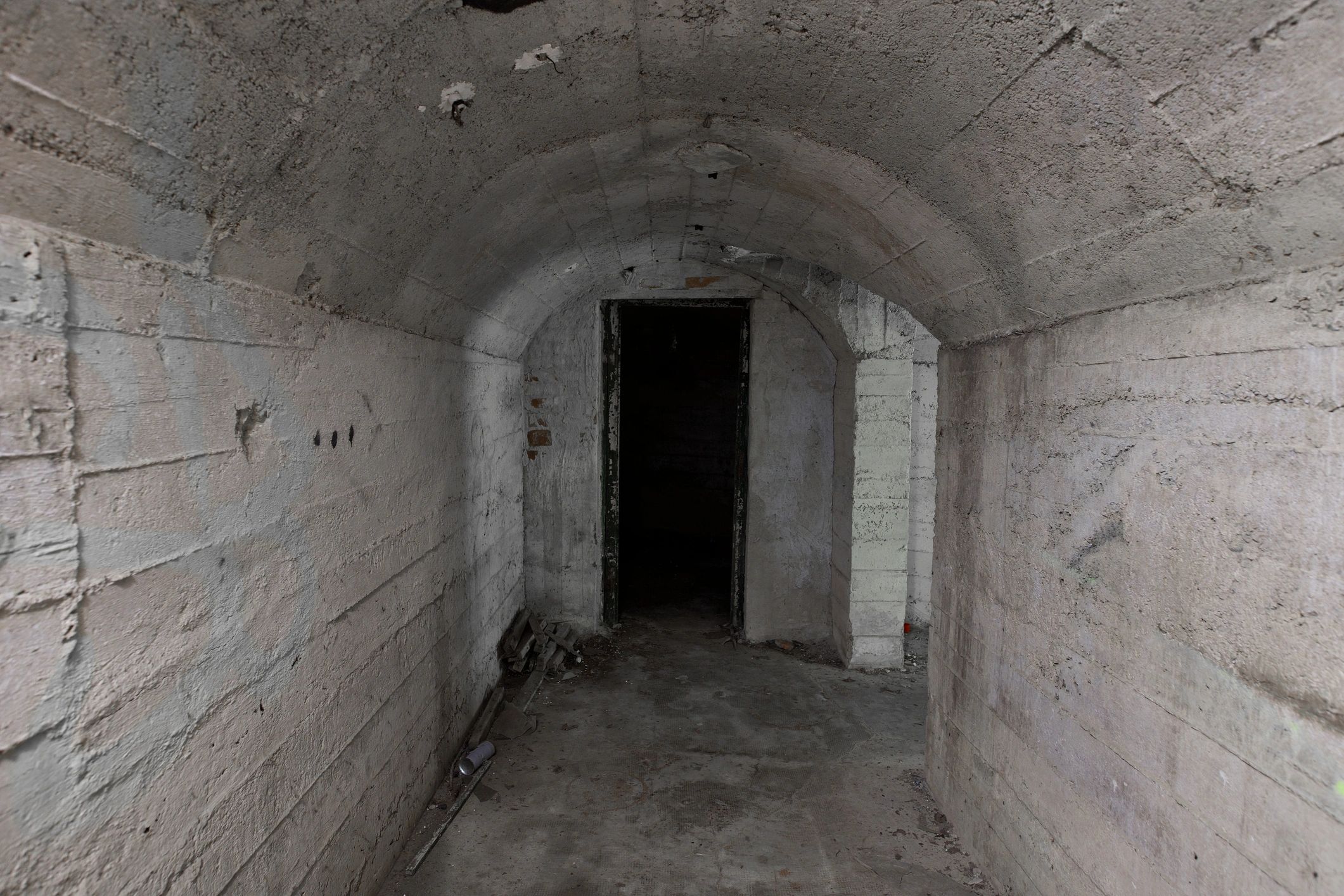 Concrete underground corridor representing EMP-resilient shelter design