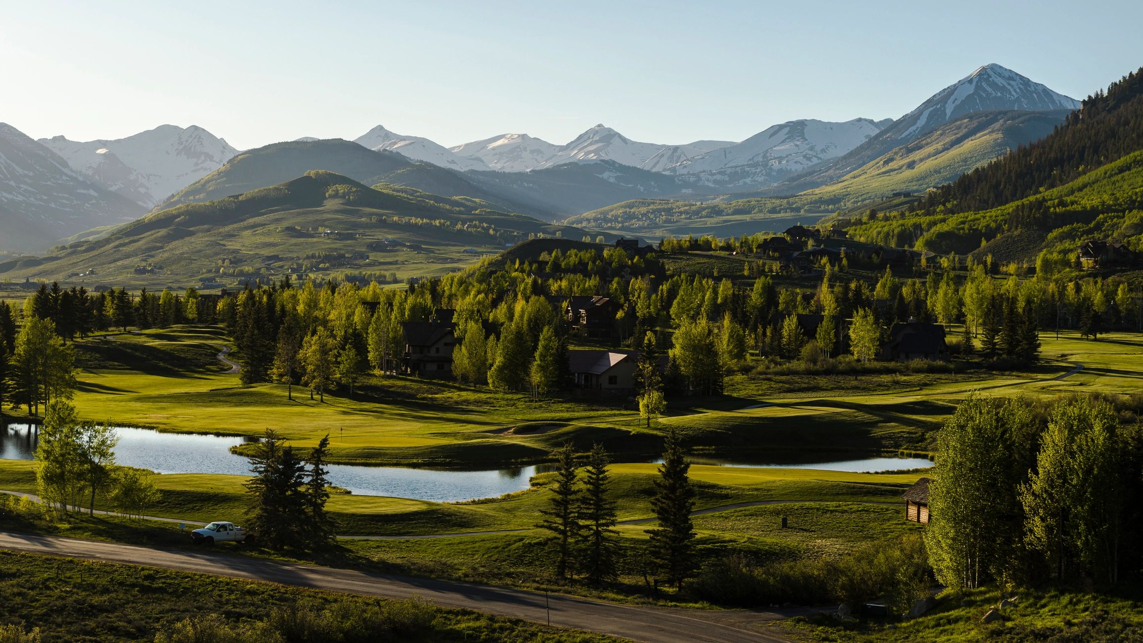Mountain landscape at evening. Valley with ponds in Gunnison County, Colorado surrounded by Rocky Mountains.