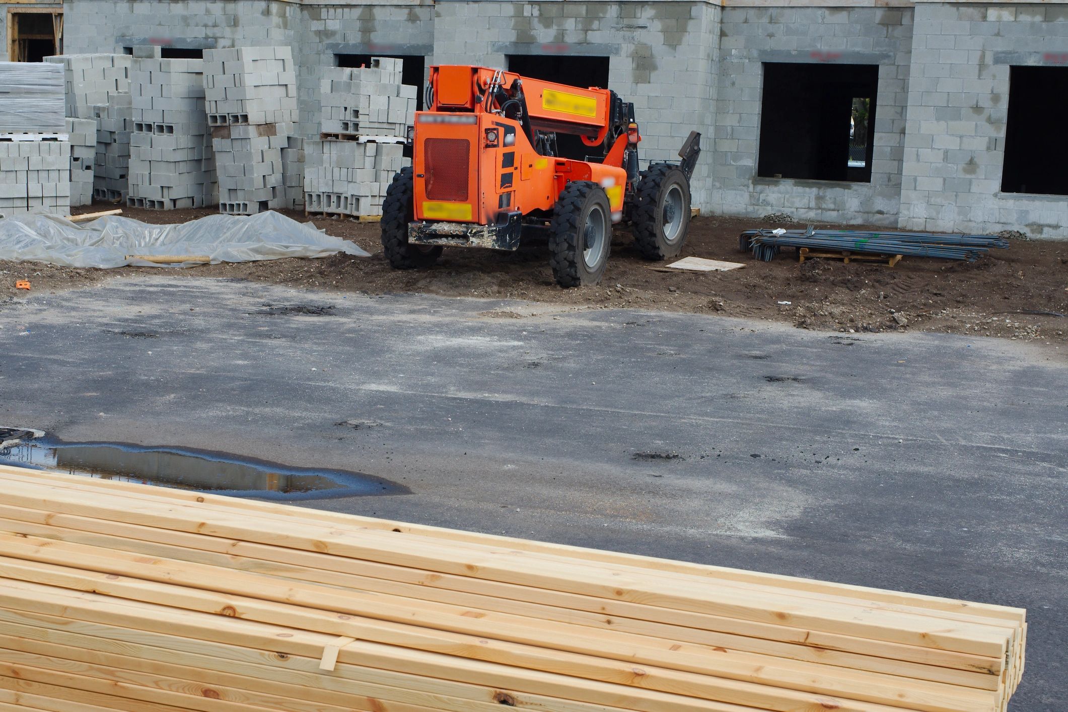 Block wall and equipment progress on active construction site