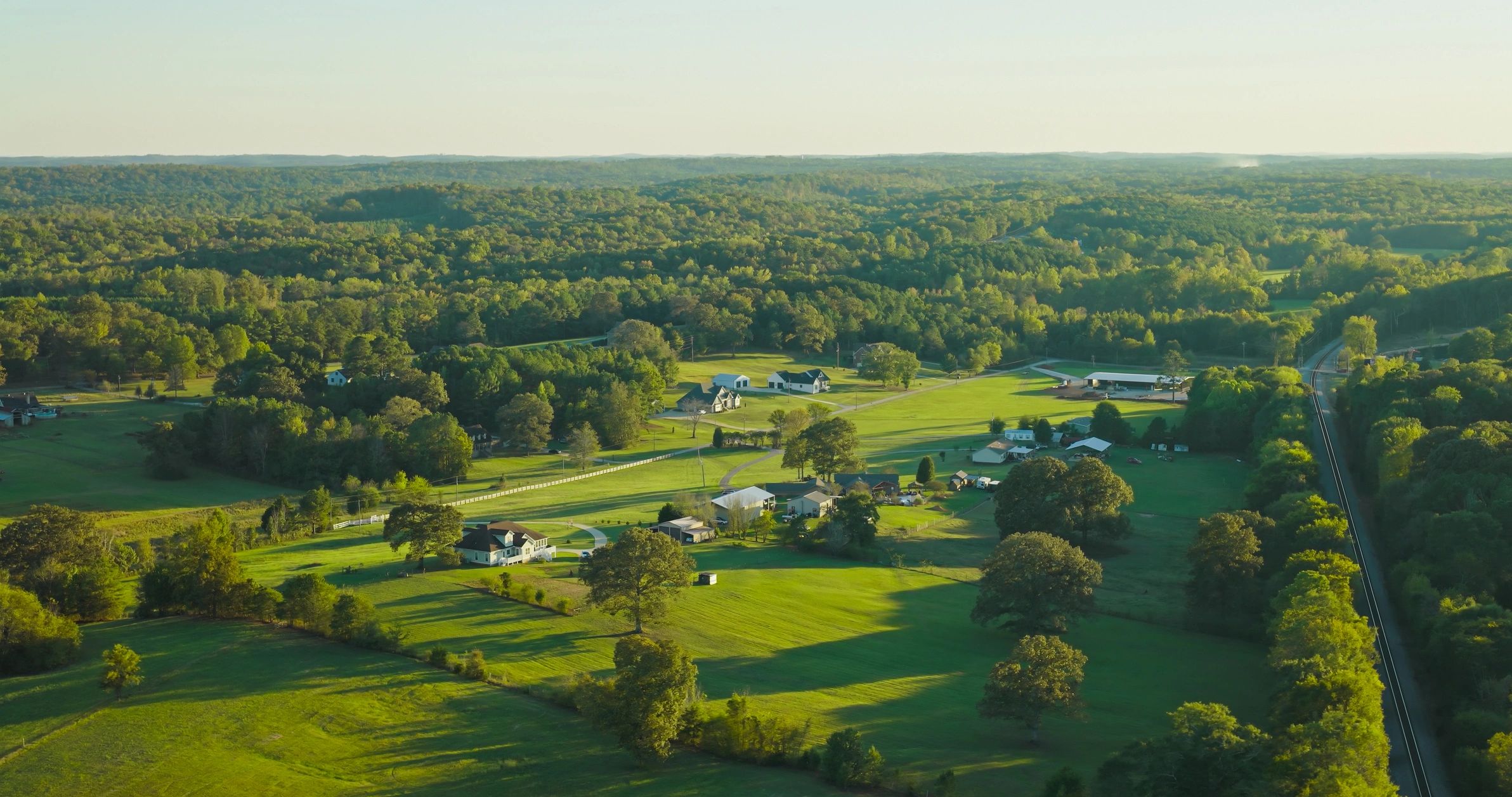 Wooded rural landscape representing Winston County bunker construction planning