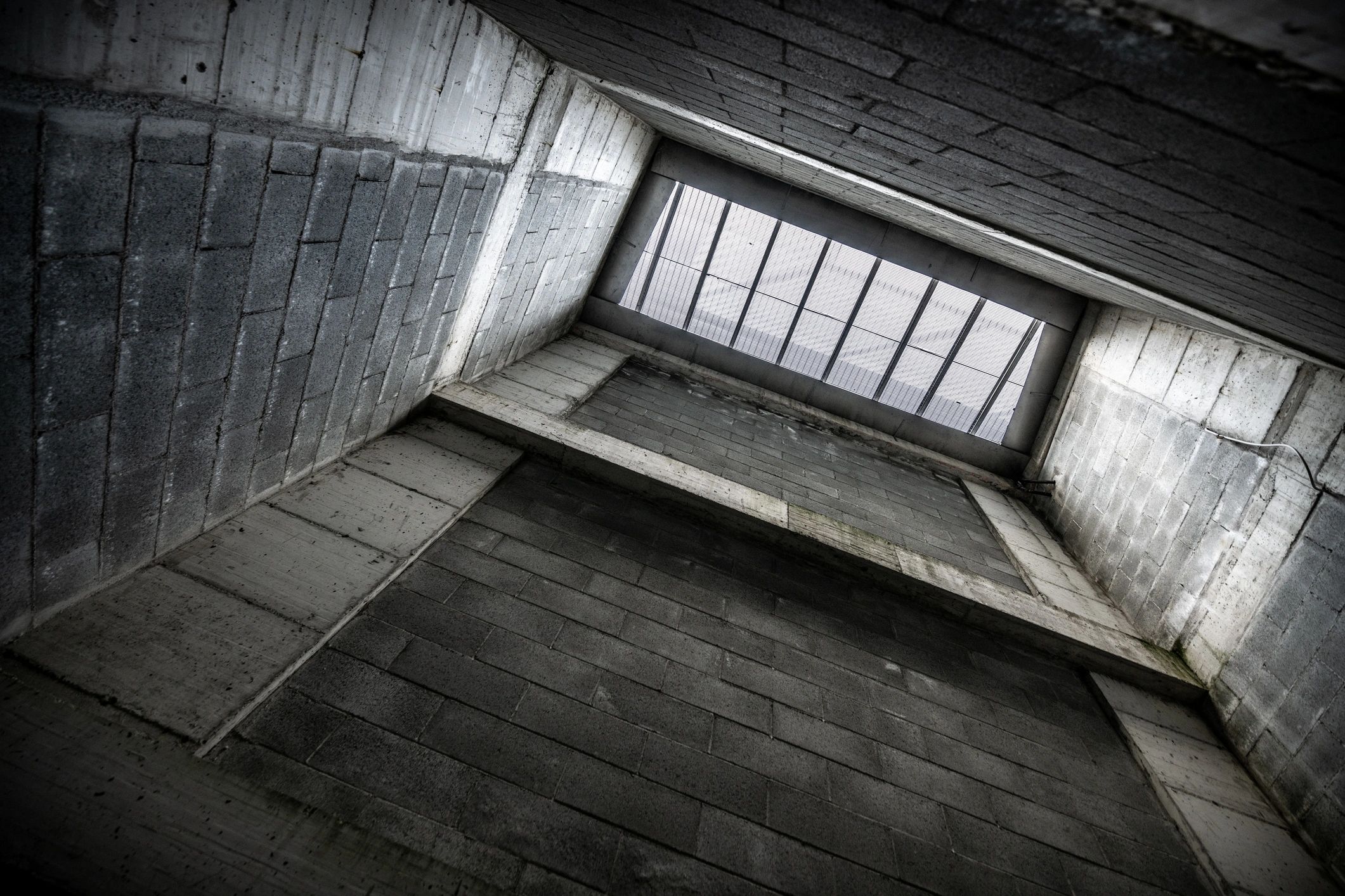 Concrete architectural entry sequence with strong structural lines