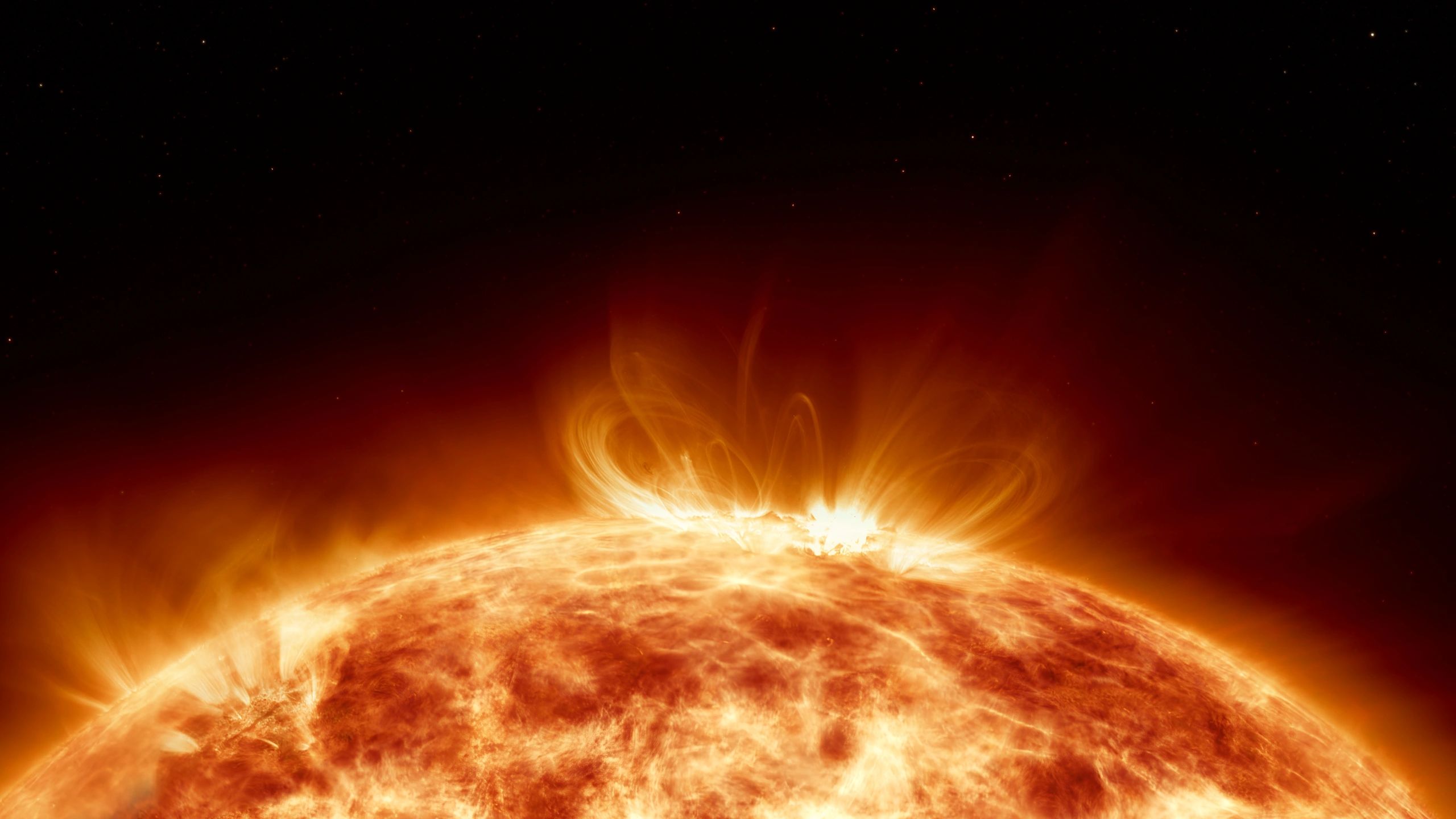 Sun with erupting plasma flares representing solar electromagnetic pulse risk