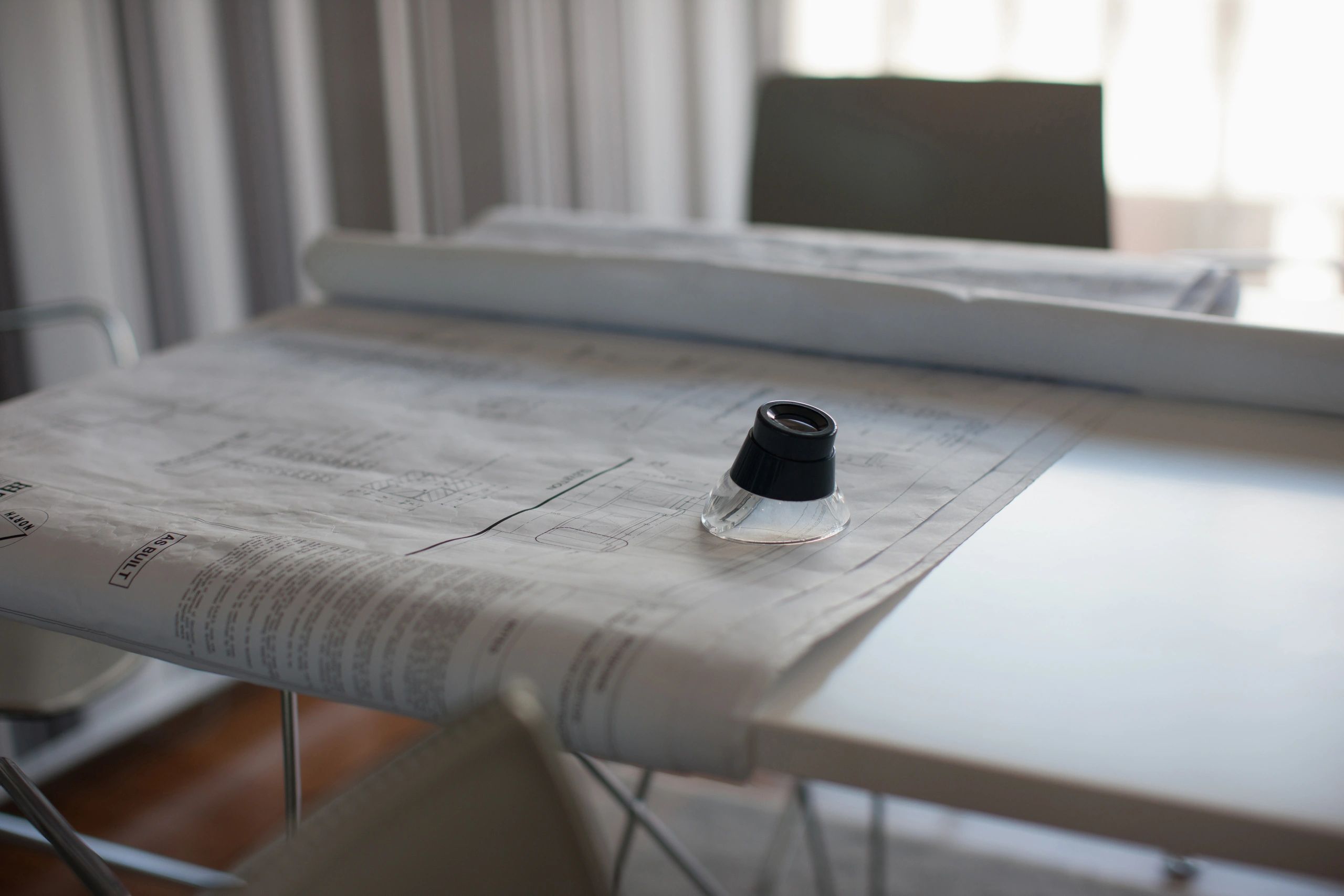 Blueprints on table in conference room