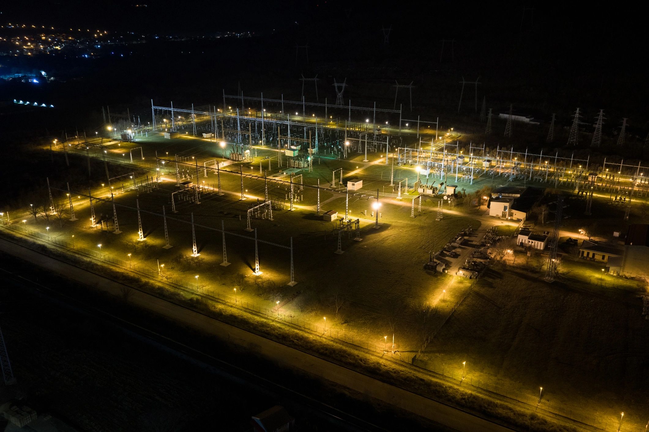 Electrical substation and transmission grid at night